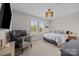 A bedroom with desk, chair, and windows providing natural light and views at 17513 Julees Walk Ln, Davidson, NC 28036
