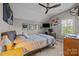 A bedroom with a fan and sloped ceiling, designed as a study and relaxing area at 17513 Julees Walk Ln, Davidson, NC 28036