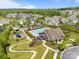 Aerial view of the community pool, clubhouse, playground, and lush landscaping. Great neighborhood amenities! at 17513 Julees Walk Ln, Davidson, NC 28036