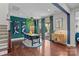 A modern dining room with a stylish table, decor, and large sliding doors leading to the outdoor area at 17513 Julees Walk Ln, Davidson, NC 28036