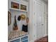 A mudroom with storage bench, hooks, and cubbies for organization and convenience at 17513 Julees Walk Ln, Davidson, NC 28036