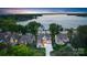 Gorgeous aerial view of the home with waterfront access and lush landscaping at 17819 John Connor Rd, Cornelius, NC 28031