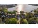 Aerial view of lakefront homes surrounded by lush trees and a sparkling lake at 17819 John Connor Rd, Cornelius, NC 28031