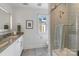Bathroom featuring vanity with stone countertop and shower at 17819 John Connor Rd, Cornelius, NC 28031