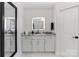Bathroom featuring a vanity with marble countertop and illuminated mirror at 17819 John Connor Rd, Cornelius, NC 28031