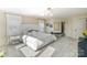 Elegant bedroom with a plush bed, decorative lighting, and ample natural light at 17819 John Connor Rd, Cornelius, NC 28031