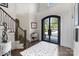 Grand foyer with a stunning front door, staircase, and elegant decor at 17819 John Connor Rd, Cornelius, NC 28031