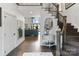 Elegant foyer with dark wood floors, staircase, and open view to the living area at 17819 John Connor Rd, Cornelius, NC 28031
