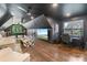 Spacious game room featuring a large TV, comfortable seating, and stylish decor at 17819 John Connor Rd, Cornelius, NC 28031