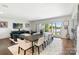 Bright open living and dining space features a lake view, ample seating, and tasteful decor at 17819 John Connor Rd, Cornelius, NC 28031