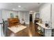 Elegant living room with hardwood floors, piano, and decorative art at 17819 John Connor Rd, Cornelius, NC 28031