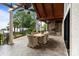 Covered outdoor dining area with views of backyard at 17819 John Connor Rd, Cornelius, NC 28031