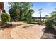 Back patio with garden and lake view at 17819 John Connor Rd, Cornelius, NC 28031