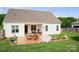 Backyard with a spacious patio, outdoor seating, and a well-maintained lawn at 179 Foy Ln, Statesville, NC 28625