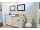 Bathroom with double sink vanity, granite countertop and contemporary fixtures and decor at 179 Foy Ln, Statesville, NC 28625