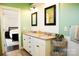 Stylish bathroom showcasing a double vanity with granite countertops and a glimpse into the bedroom at 179 Foy Ln, Statesville, NC 28625