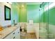 Bright bathroom offers double vanity, granite counters, soaking tub, and glass shower at 179 Foy Ln, Statesville, NC 28625