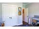 Neutral Bedroom features a closet, open doorway, and a grey baby bed, creating a calm space at 179 Foy Ln, Statesville, NC 28625