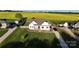 Charming home on expansive lot, with well-manicured lawn and surrounded by lush green and yellow fields at 179 Foy Ln, Statesville, NC 28625
