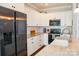Modern kitchen with stainless steel appliances, granite countertops and ample white cabinets at 179 Foy Ln, Statesville, NC 28625