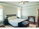 Spacious main bedroom with trey ceilings, and a bed with side tables on a hard wood floor at 179 Foy Ln, Statesville, NC 28625