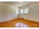 Bedroom with hard wood floors and natural light from two windows at 191 Scenic Ne Dr, Concord, NC 28025