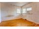 Bedroom features hard wood floors, neutral walls, and a large window at 191 Scenic Ne Dr, Concord, NC 28025