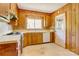 Functional kitchen with wood cabinets and access to a door at 191 Scenic Ne Dr, Concord, NC 28025