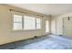 Spacious living room with neutral walls, large window and access to the exterior at 191 Scenic Ne Dr, Concord, NC 28025