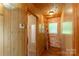 Attic space with wood-paneled walls, ladder, and unique architectural details at 201 Trinity St, Clover, SC 29710