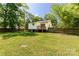 View of the home's backyard with a wooden deck and fenced in yard with plenty of room to enjoy the outdoors at 201 Trinity St, Clover, SC 29710
