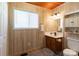 Bathroom featuring a single vanity, wooden accents, with tiled flooring and a neutral wall color at 201 Trinity St, Clover, SC 29710