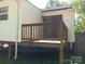 The home has a back porch with wood railings at 201 Trinity St, Clover, SC 29710