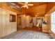 Inviting living room with wood-paneled walls, vaulted ceiling, and modern flooring at 201 Trinity St, Clover, SC 29710