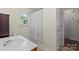Bathroom featuring neutral walls, a white shower curtain, and a tiled floor at 202 Pond View Dr, Salisbury, NC 28147