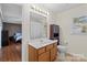 Bathroom featuring a combination shower-tub, toilet, and a wood vanity at 202 Pond View Dr, Salisbury, NC 28147