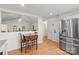 Bright kitchen featuring stainless steel appliances, white cabinets, and a cozy breakfast nook with a table at 202 Pond View Dr, Salisbury, NC 28147