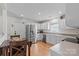 Bright kitchen featuring stainless steel appliances, white cabinets, and a cozy breakfast nook with a table at 202 Pond View Dr, Salisbury, NC 28147