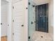 Bathroom with glass-enclosed shower and modern tile at 2117 Roslyn Ave, Charlotte, NC 28208
