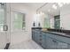Bathroom with dual vanities and modern fixtures at 2117 Roslyn Ave, Charlotte, NC 28208