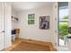 Bright entryway with bench seating, coat hooks and a window at 2117 Roslyn Ave, Charlotte, NC 28208