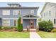 Charming curb appeal with American flag and professionally maintained lawn and landscaping at 2117 Roslyn Ave, Charlotte, NC 28208