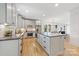 Modern kitchen with light cabinets, stainless steel appliances, and center island at 2117 Roslyn Ave, Charlotte, NC 28208