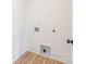 Laundry room with hardwood floors at 2117 Roslyn Ave, Charlotte, NC 28208