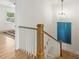 Staircase with white railing and natural wood accents at 2117 Roslyn Ave, Charlotte, NC 28208