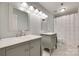 Well-lit bathroom with dual vanities, modern mirrors, and a shower-tub combo at 2345 Sparrow Dr, Rock Hill, SC 29732
