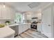 Well-lit kitchen with white cabinets, stainless steel appliances, and a subway tile backsplash at 2345 Sparrow Dr, Rock Hill, SC 29732