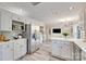 Bright, spacious kitchen with white cabinets, stainless steel appliances, and a view of the living area at 2345 Sparrow Dr, Rock Hill, SC 29732