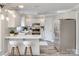 Modern kitchen featuring white cabinets, stainless steel appliances, and a breakfast bar at 2345 Sparrow Dr, Rock Hill, SC 29732