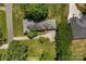 Aerial view of the home with a large backyard and surrounding trees at 2410 Armstrong Park Dr, Gastonia, NC 28054